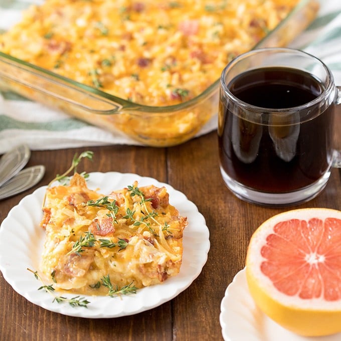 A plate of food and a glass of orange juice