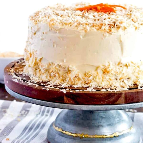 Frosted carrot cake on a pedestal
