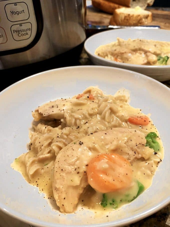 Plate of Instant Pot Creamy Chicken with vegetables.