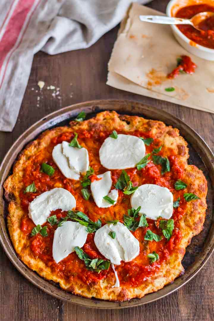 A pizza sitting on top of a wooden table