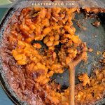 A pan of food, with Baked beans