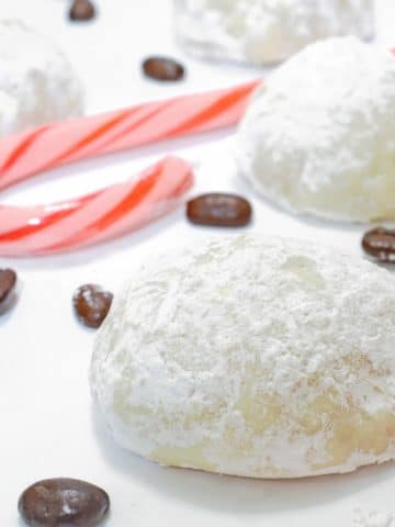 Snowball cookies with candy canes.