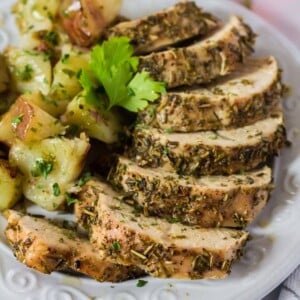 Plattrer of turkkey tenderloing sprinkled with dried herbs.