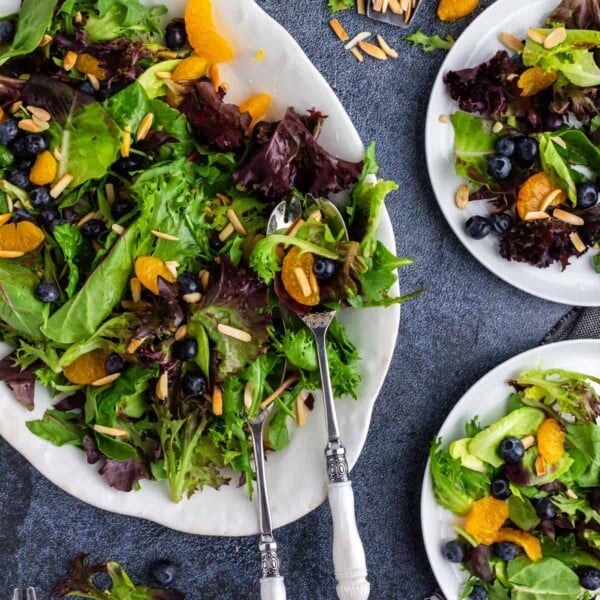 A colorful salad with oranges and blueberries