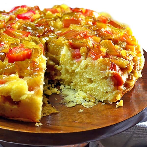 A rhubarb cake on a pedistal.