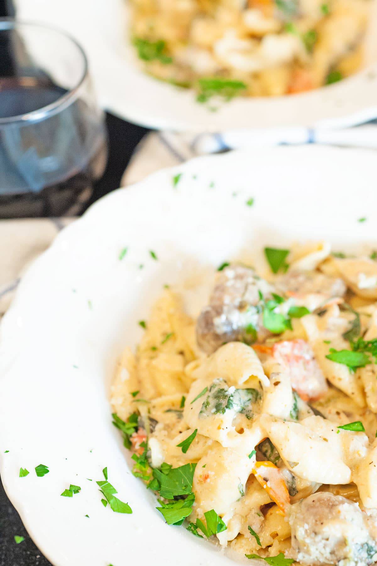 Bowlf of Italian Sausage and creamy pasta.