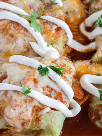 Keto Enchiladas with sour cream garnish