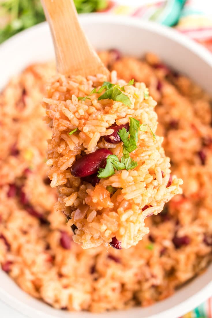 Wooden spoon of Mexican rice and beans.