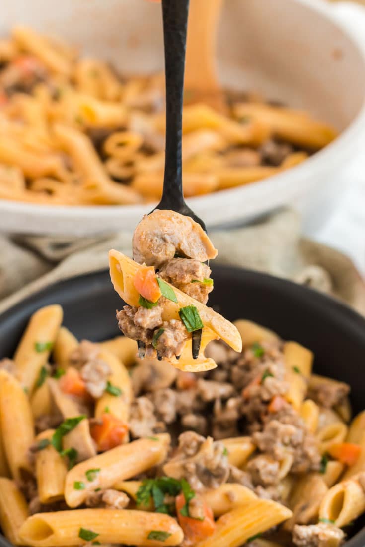 Skillet of pasta and ground beef.