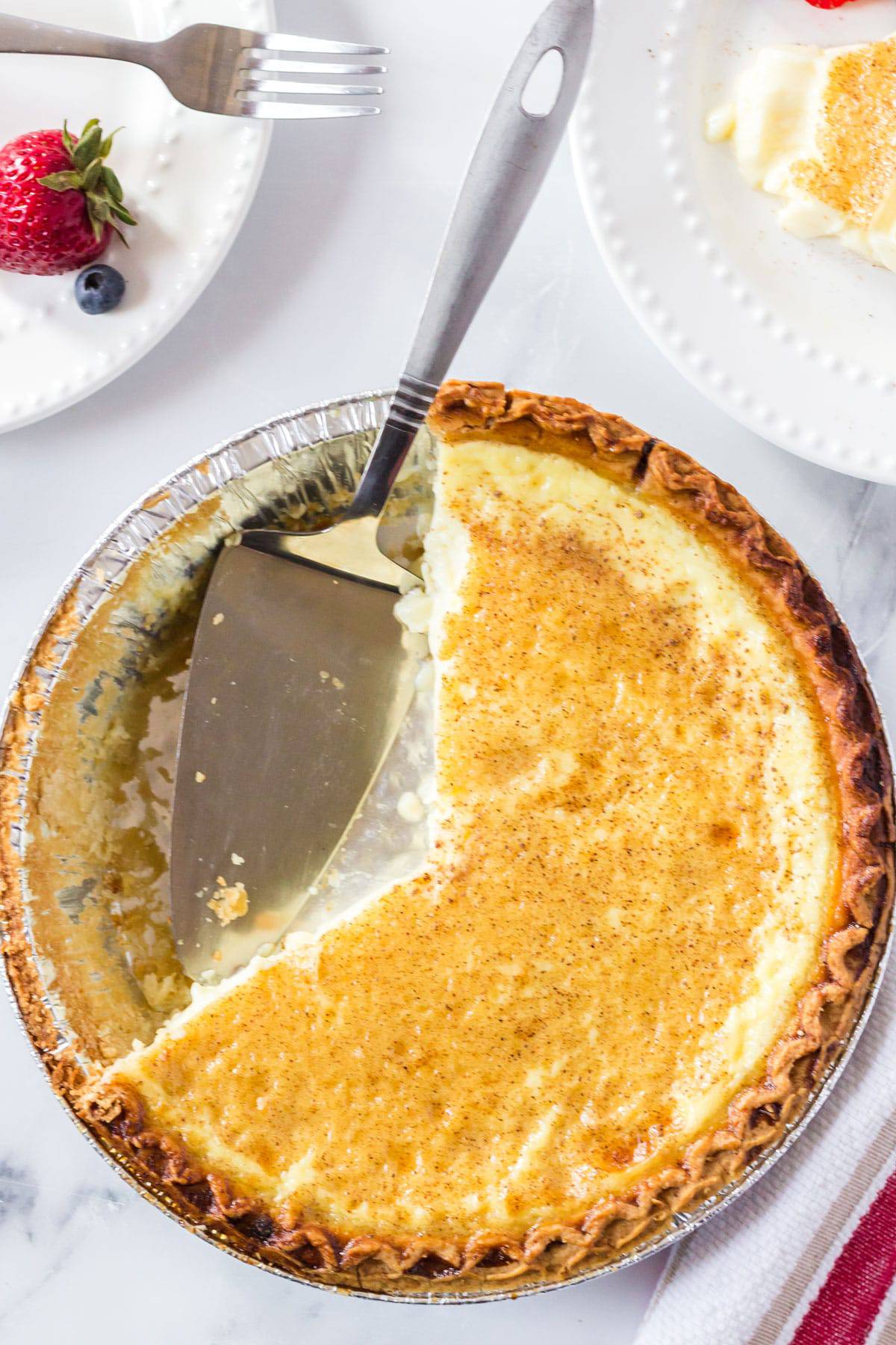 Egg custard pie. Overhead view of an egg cusgtard pie with a couple of slickes missing.