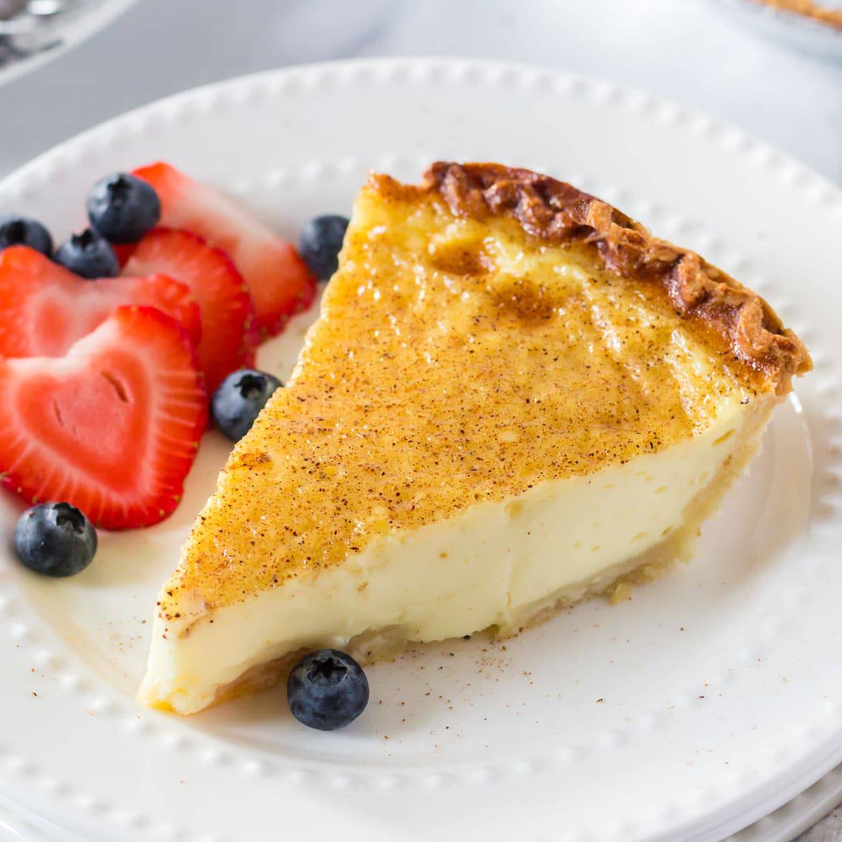 A slice of homemade pie with fresh berries