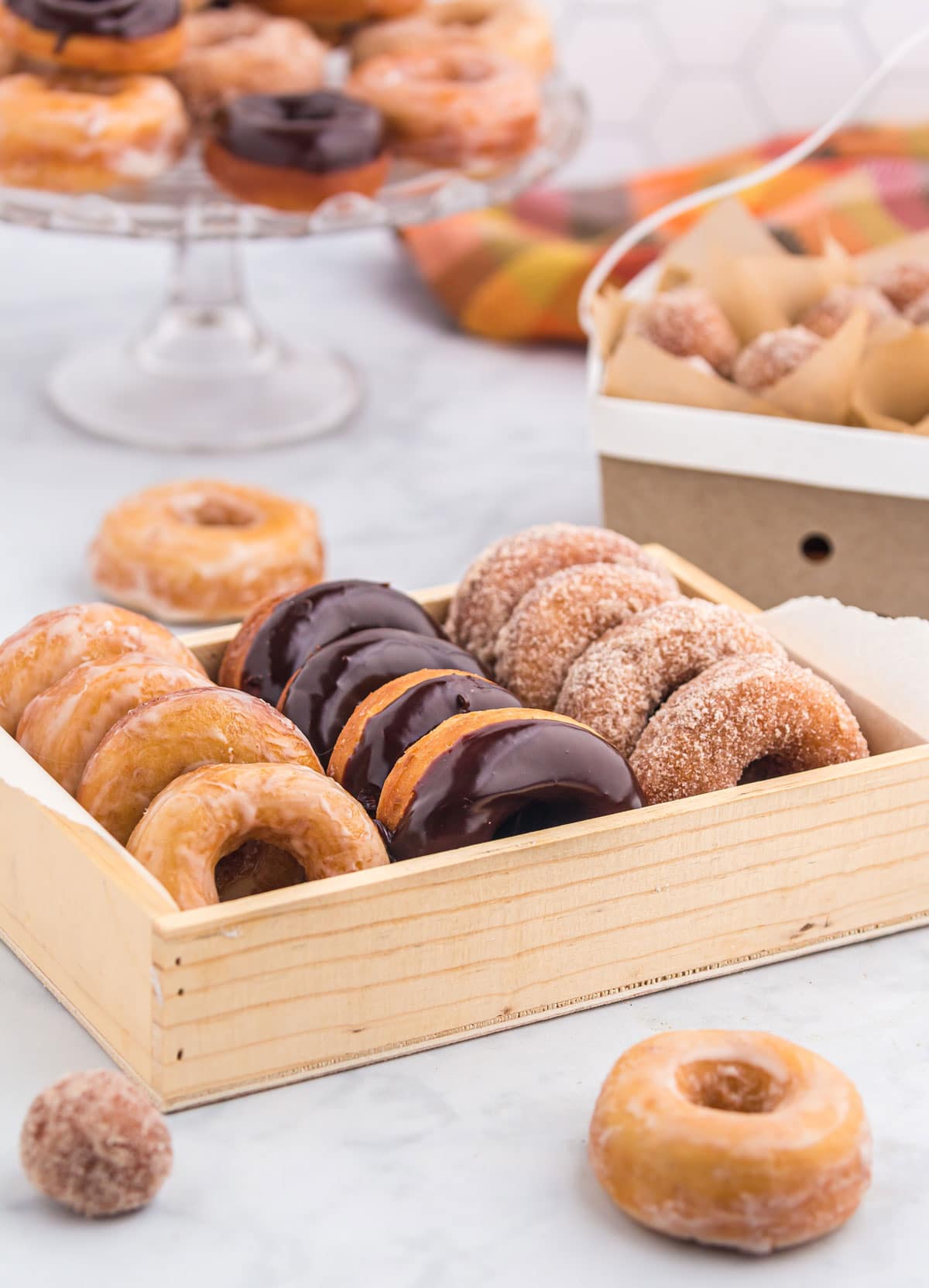 A variety of glazed donuts in a box