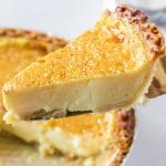 A slice of egg custard pie on a spatula