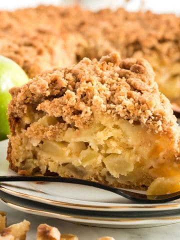 A slice of apple buckle on a plate