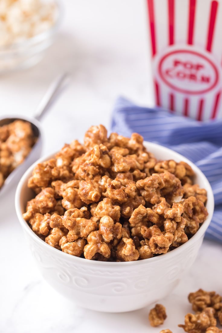 A bowl of food on a plate, with Caramel and Popcorn