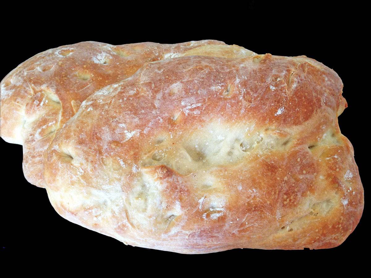 homemade loaf of ciabatta bread Overhead view of loaf of ciabatta berad