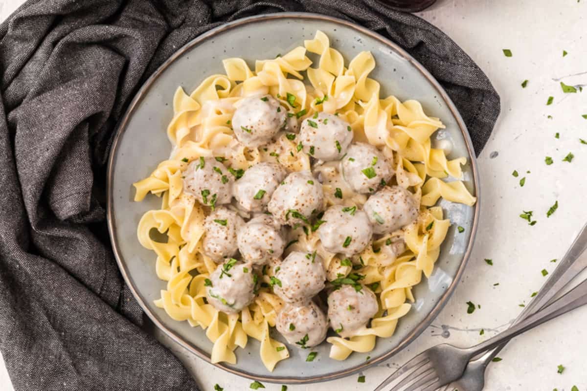 A plate of meatball stroganoff over egg noodles