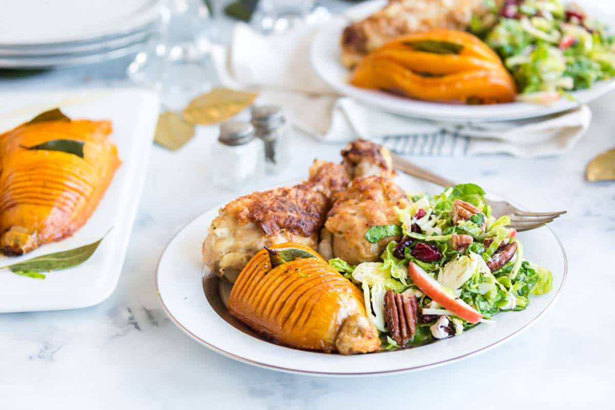 A holiday table with a bunch of fancy-looking food