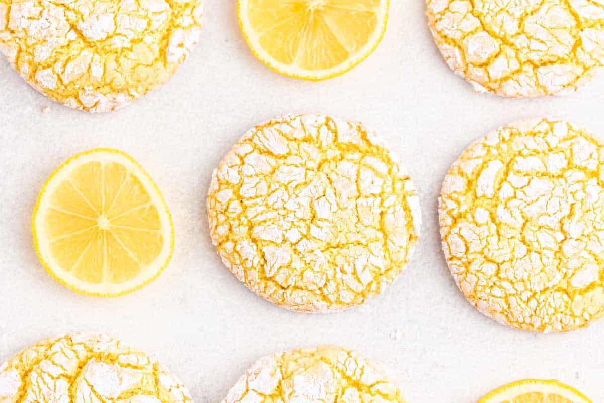 Lemon cake mix cookies A bunch of lemon cookies with lemon slices.