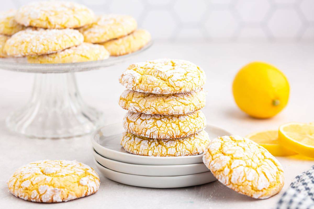 Lemon cake mix cookies on display. A batch cookies on a plate with a lemon.