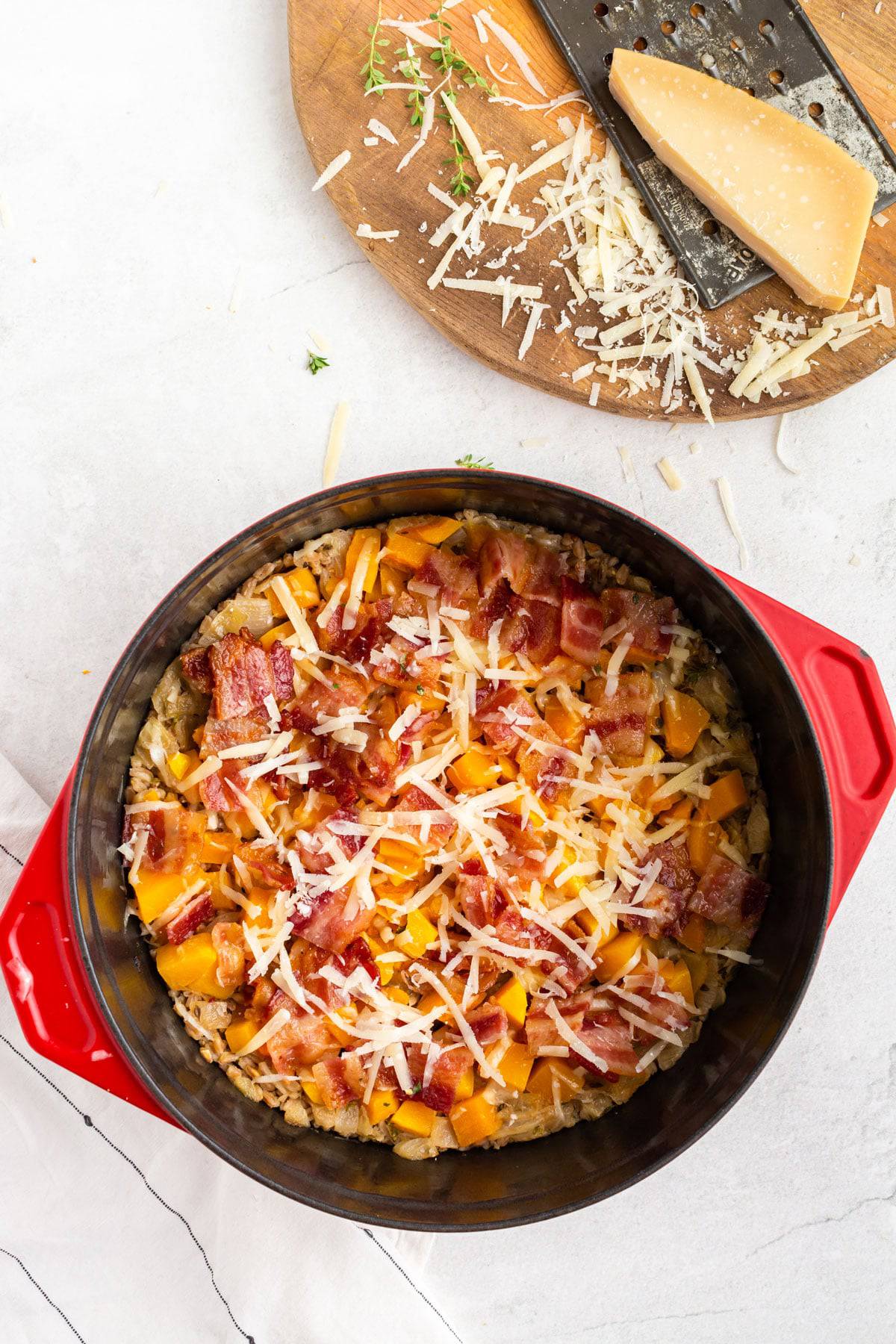 How to make a farro casserole Grated Parmesan cheese over a casserole