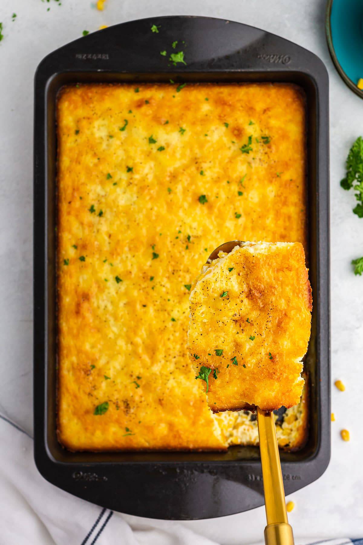 Serving corn casserole Scooping out some corn casserole