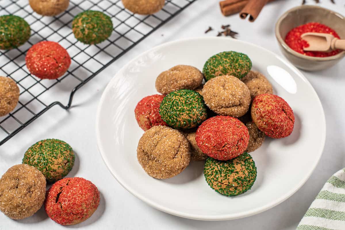 A plate of Christmas spice cookies A bunch of colorful Christmas cookies on a plate