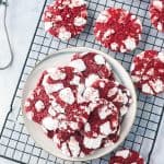 A cooling rack with red velvet cookies