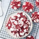 A cooling rack with red velvet cookies