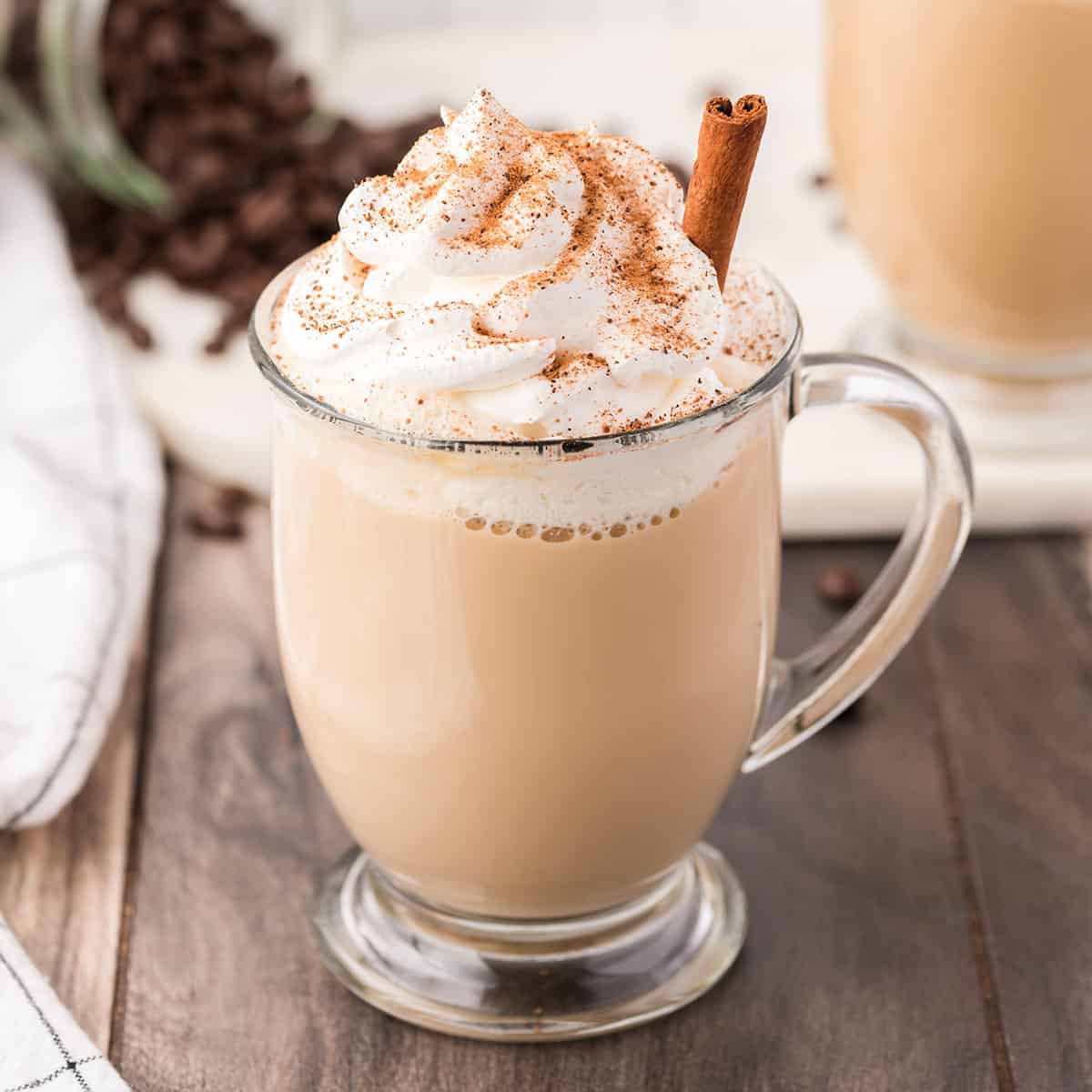 Eggnog Latte in a glass A glass of Eggnog Latte with cinnamon stick