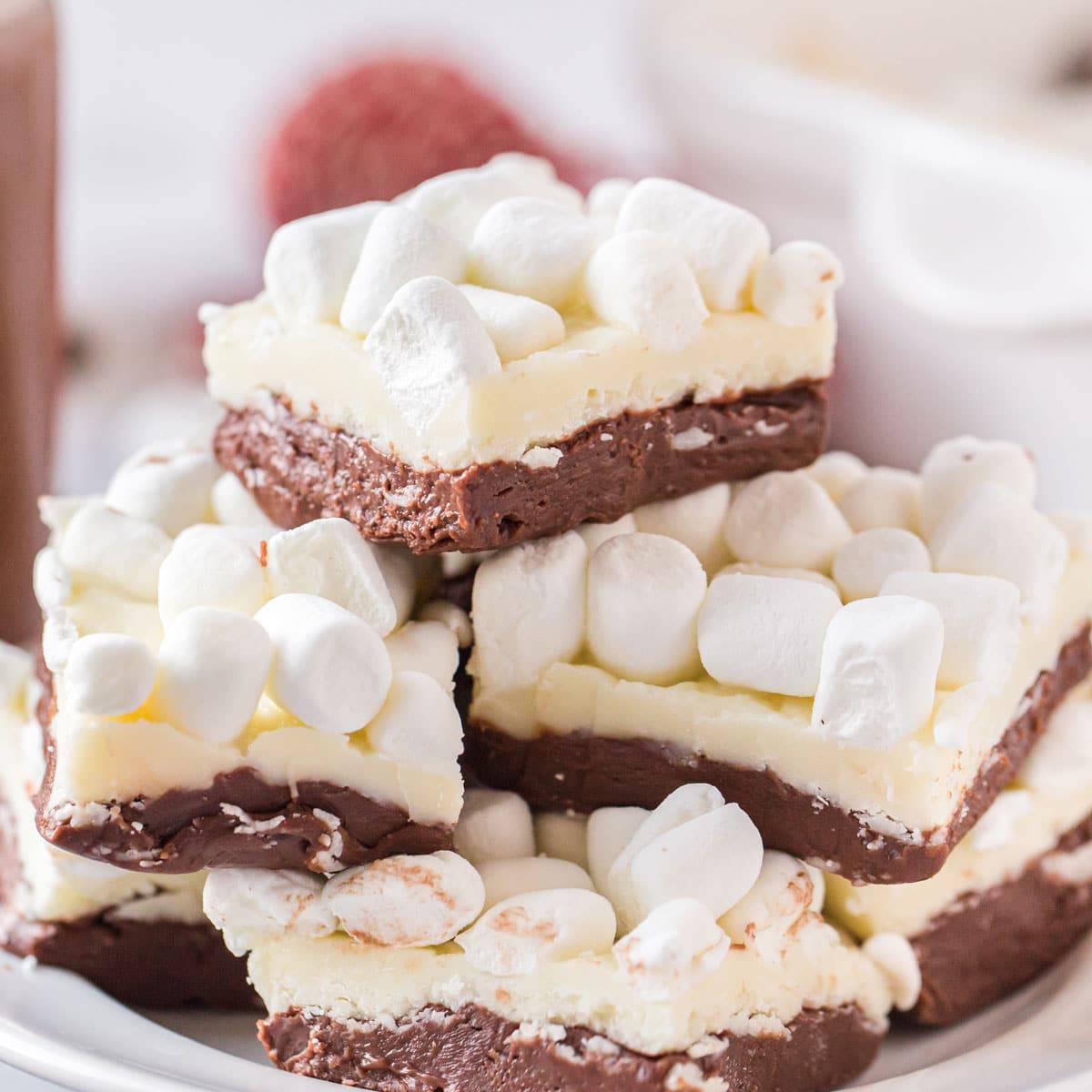 Hot chocolate fudge recipe A pile of hot chocolate fudge topped with mini marshmallows.