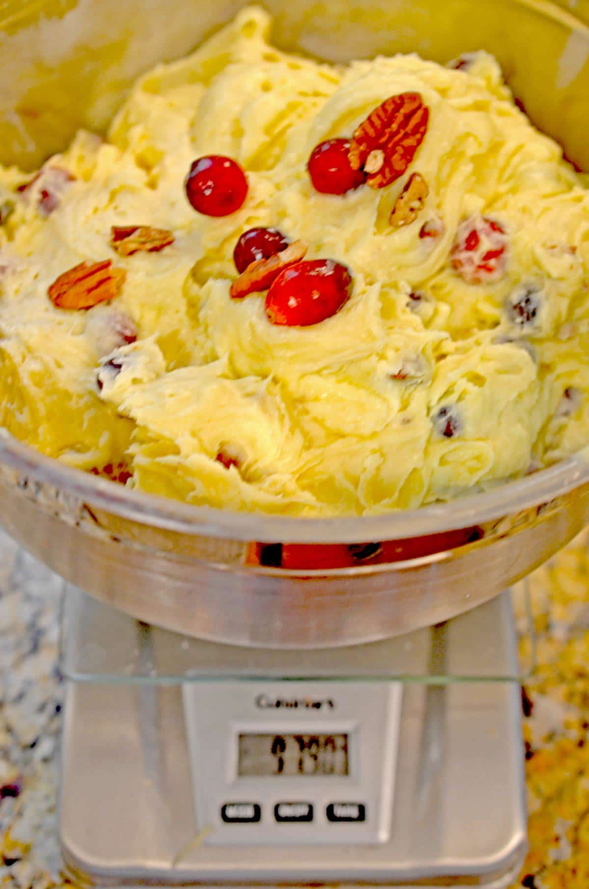 A bowl of dough on a kitchen scale.