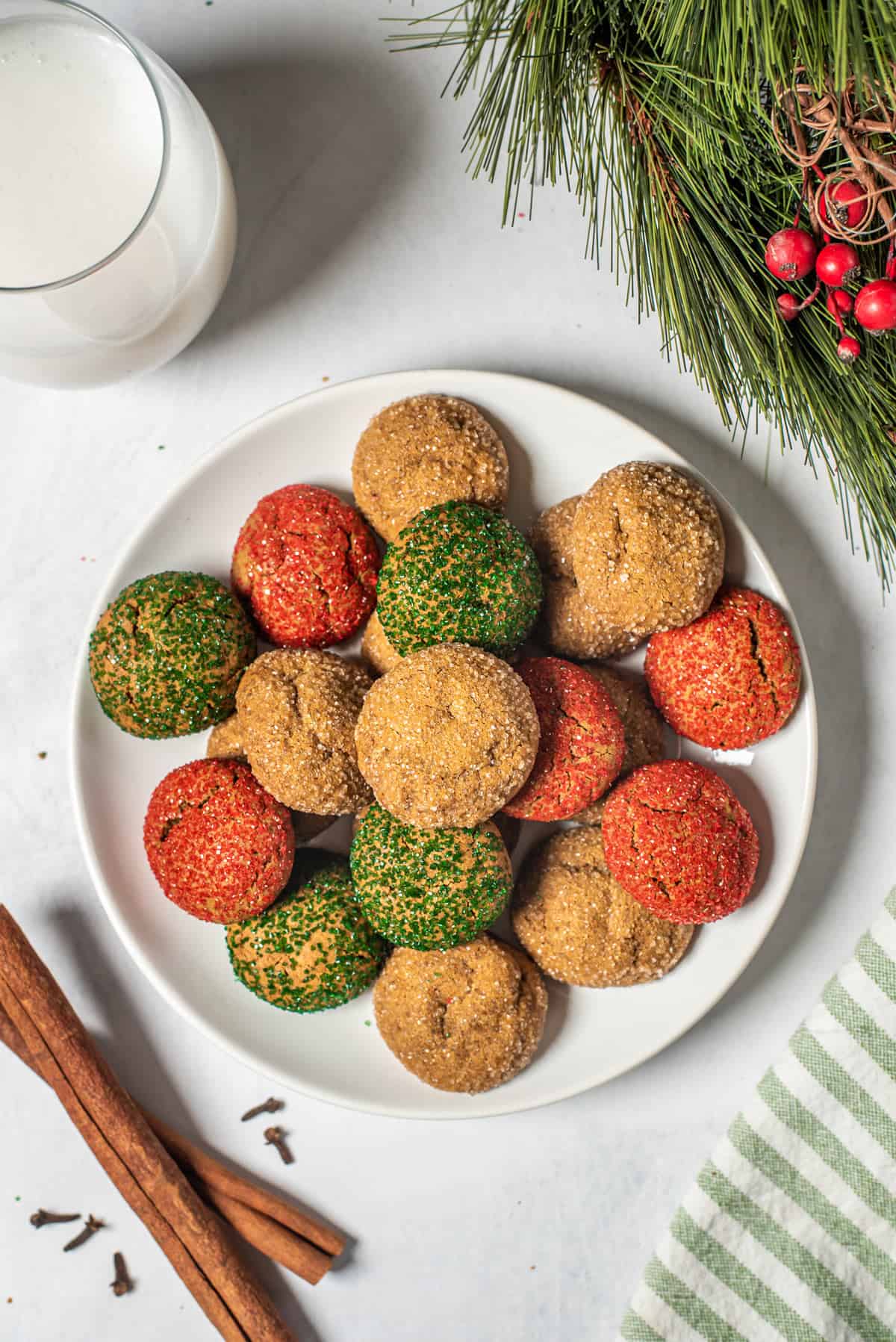 A plate of Christmas spice cookies and a glass of milk