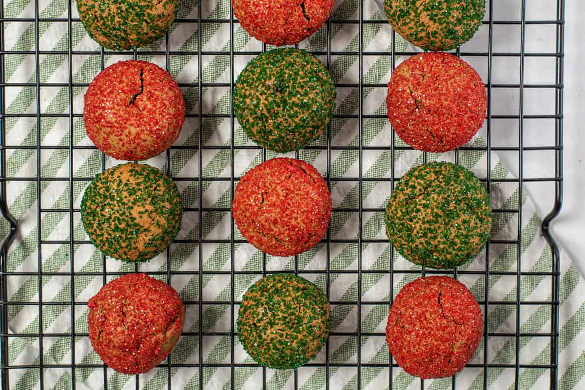 A cooling rack full of colorful crinkle cookies