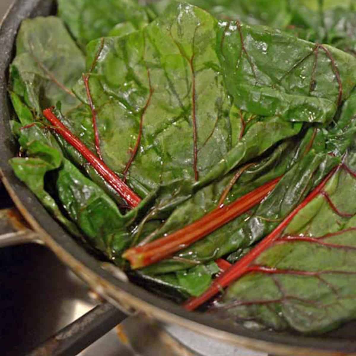 A suatee pan of swiss chard A pan of Swiss chard.