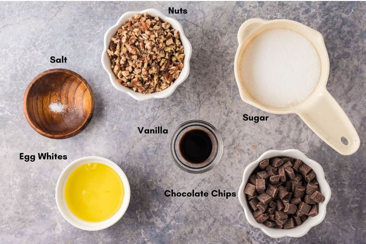 Overnight cookies recipe. Egg whites, sugar, and other ingredients for chocolate chip meringue cookies.