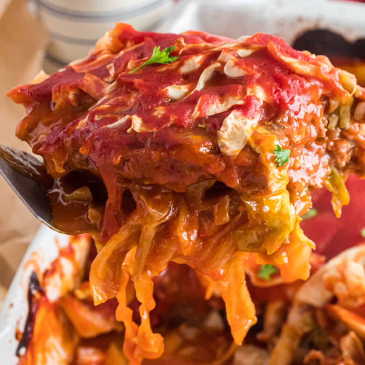 a serving of cabbage roll casserole being scooped up.