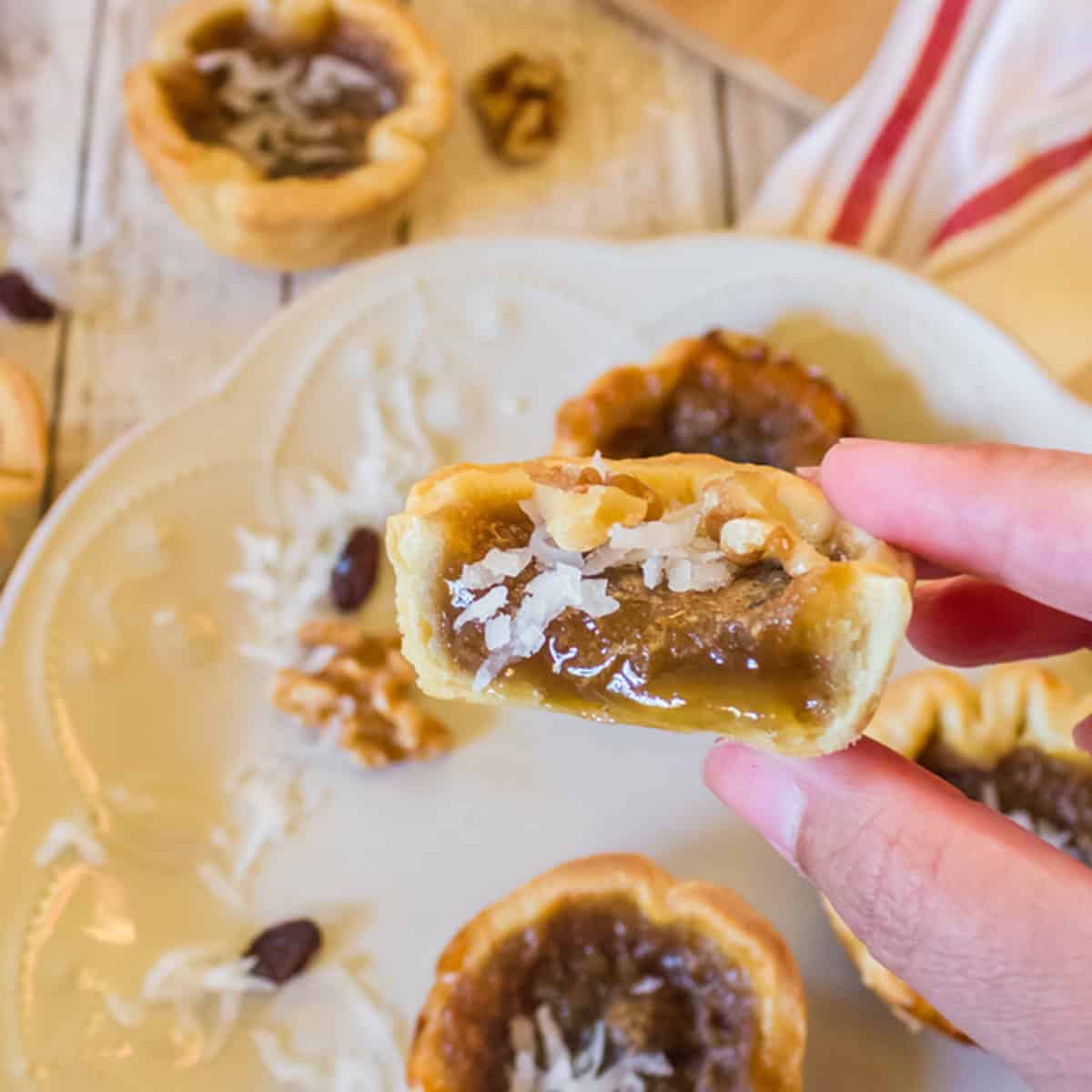 A bite of a runny Canadian butter tart.