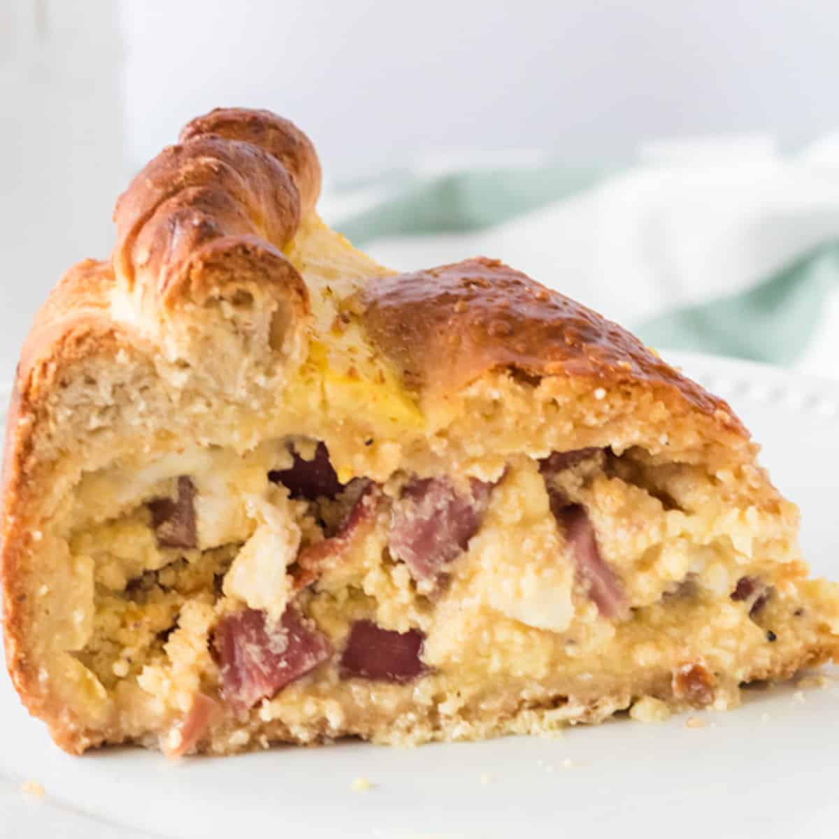 a slice of Italian Easter pie on a plate.