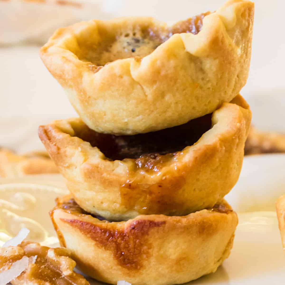 A stack of 3 butter tarts.