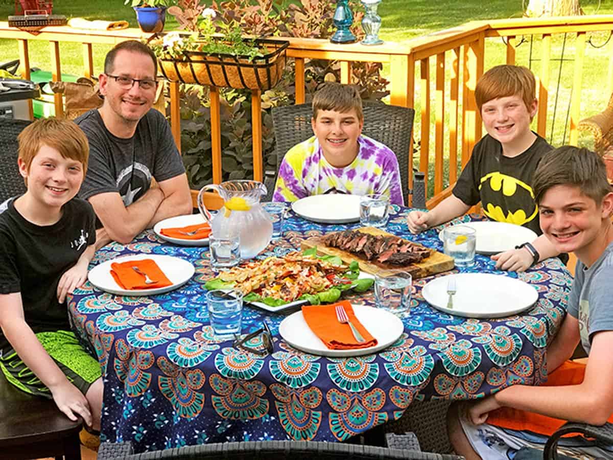 A family eating outside.