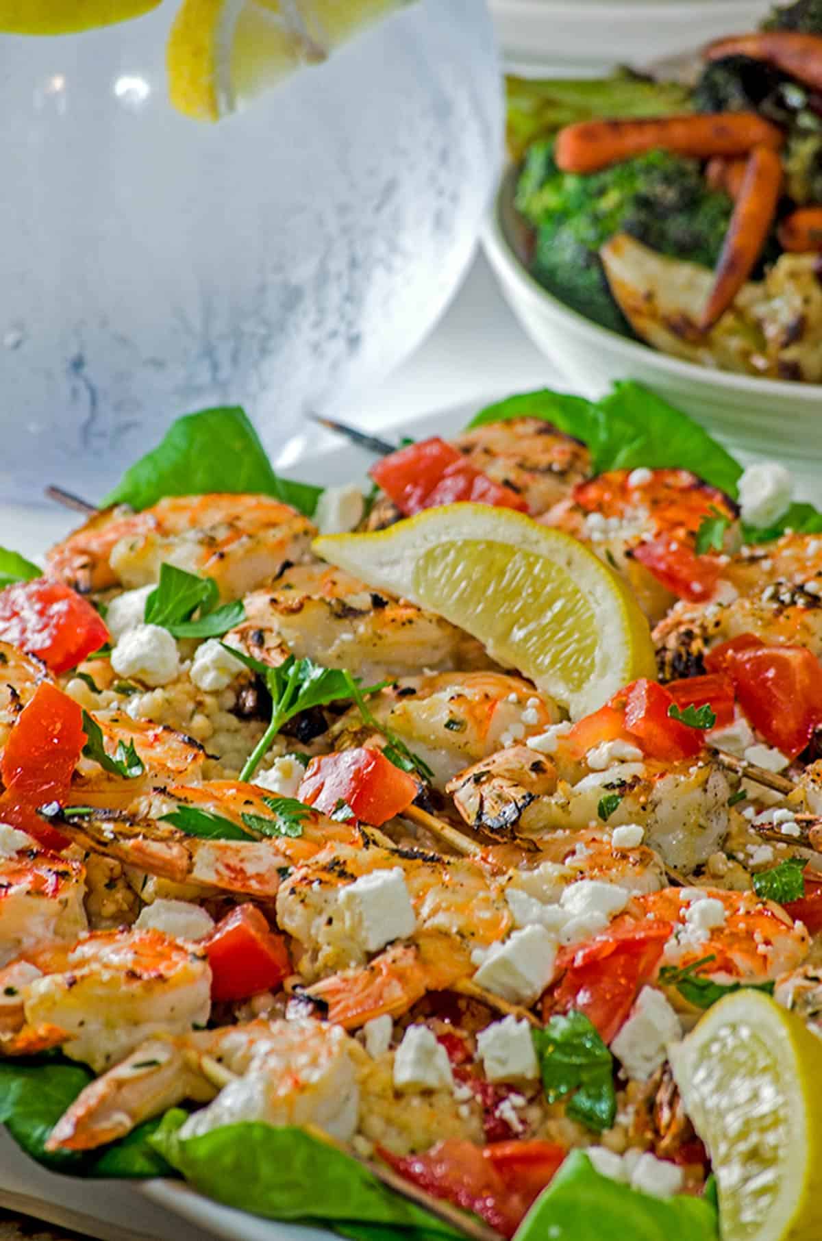 A plate of shrimp with feta cheese.