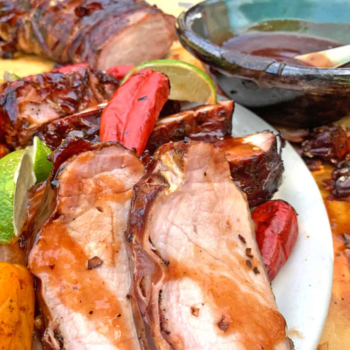 A plate of smoked pork with barbecue sauce.