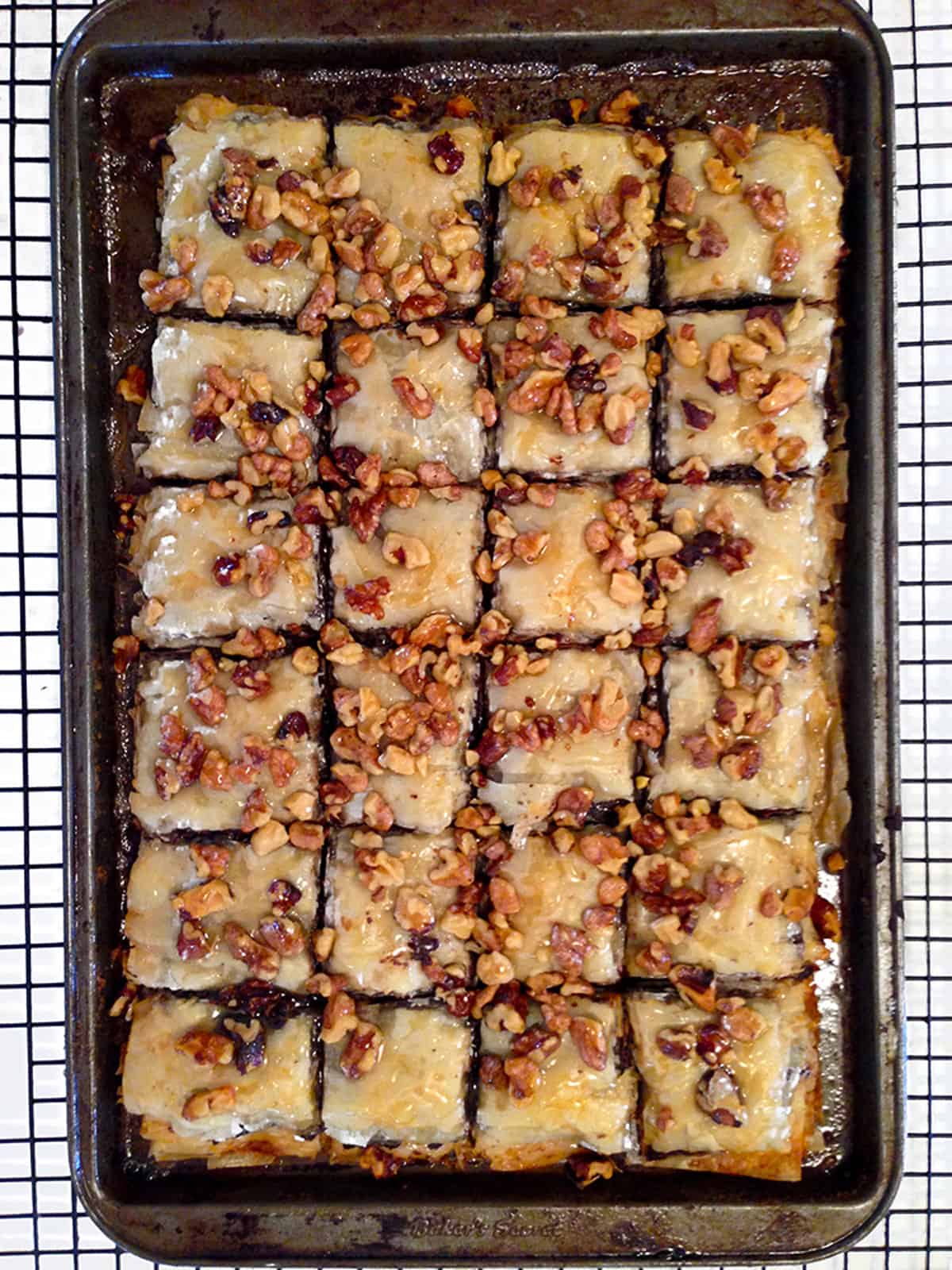 A pan of baklava on a cooling rack.