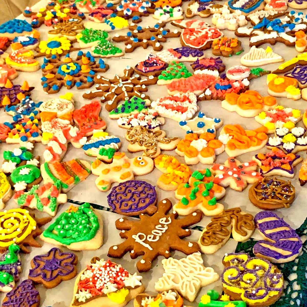 A table full of colorful Christmas cookies.