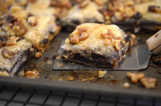 A spatula holding a piece of baklava.