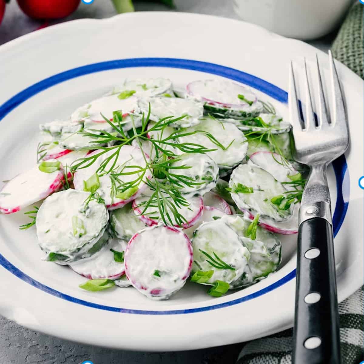 A bowl of cucumber salad.