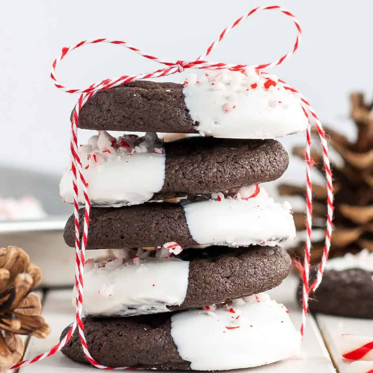 A stack of cookies with a ribbon tied around them.