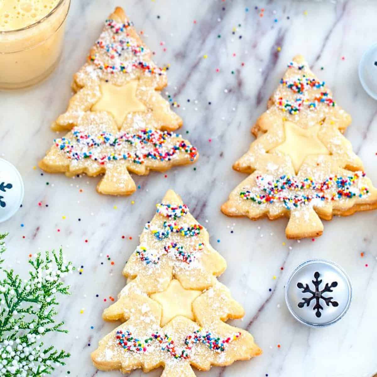 A group of cookies shaped like Christmas trees.