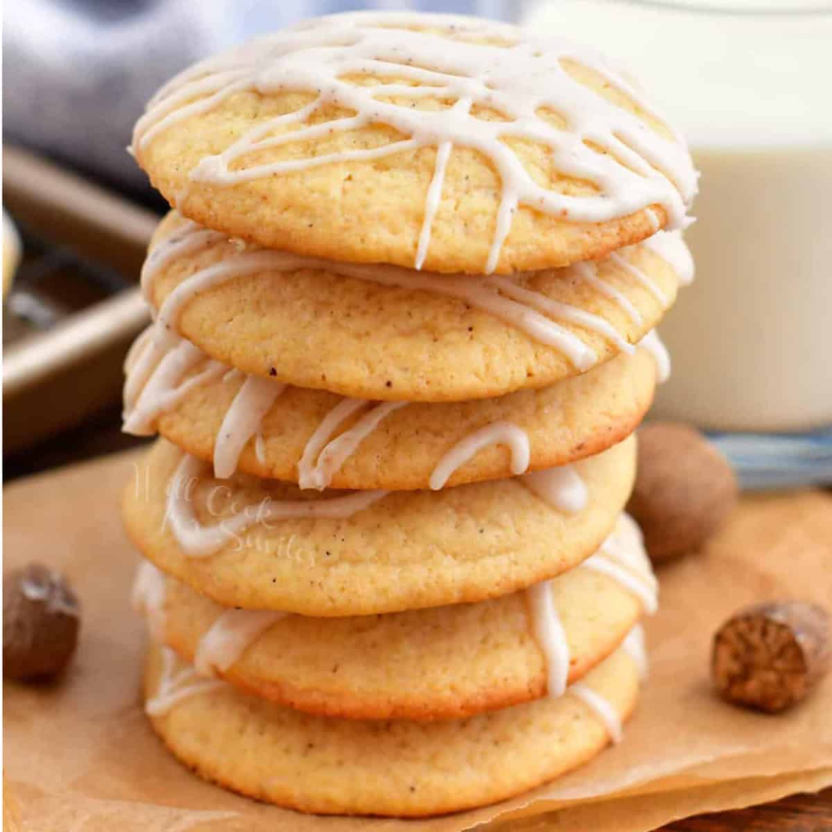 A stack of cookies drizzled with a white glaze.